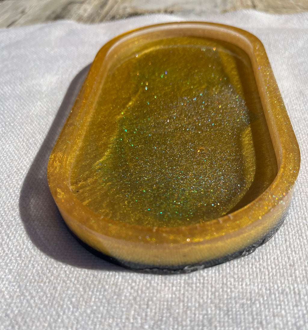 Gold and black resin oval tray or trinket dish