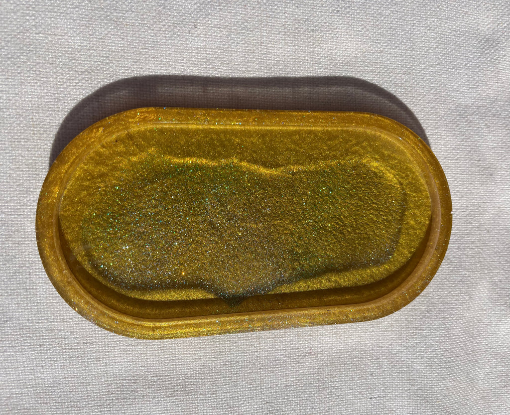 Gold and black resin oval tray or trinket dish