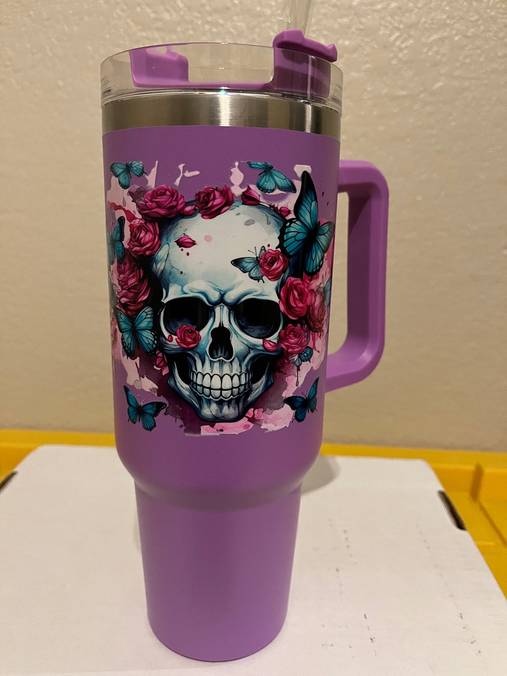 40oz  stainless steel tumbler with roses, butterflies and a skull
