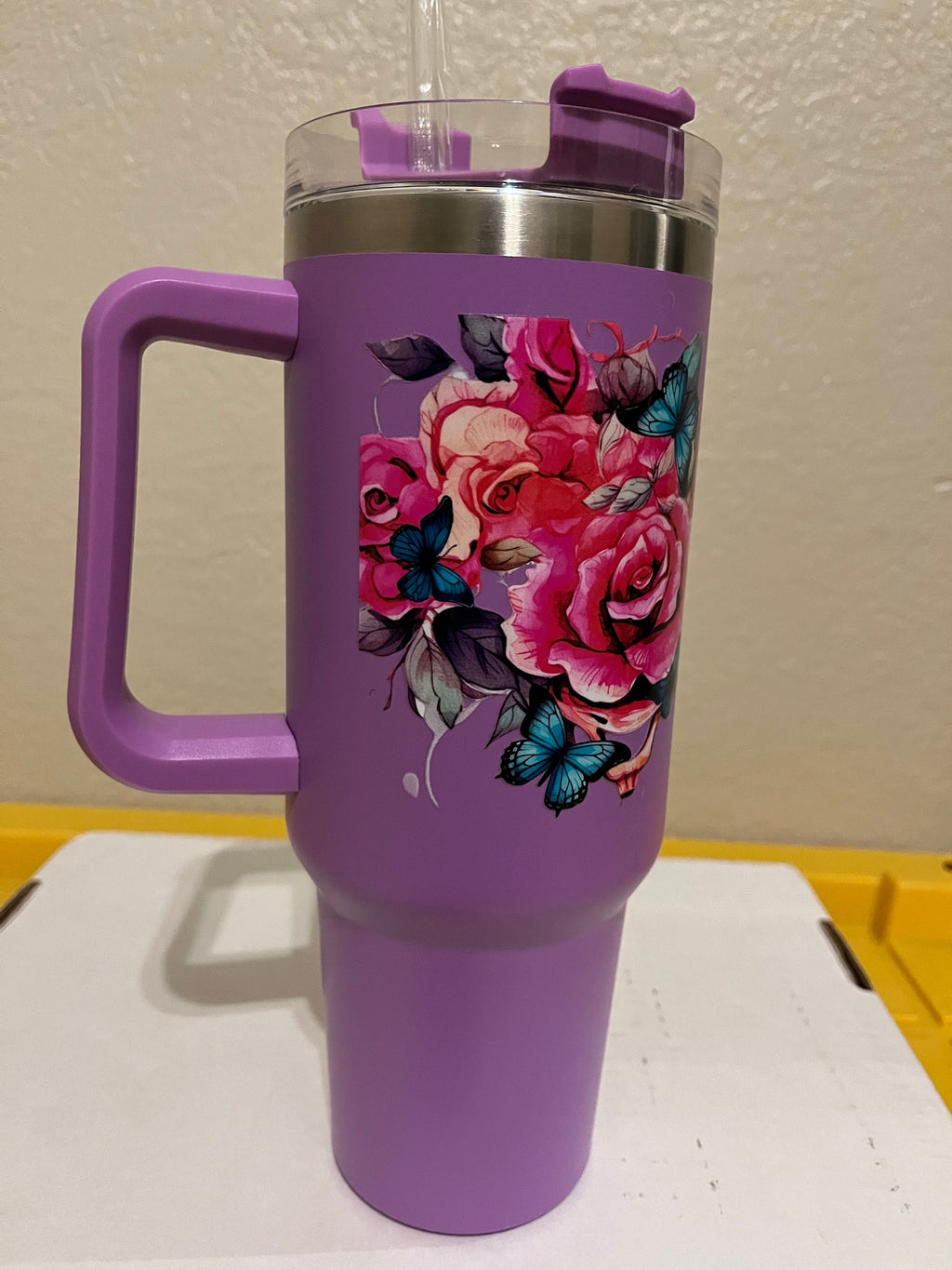 40oz  stainless steel tumbler with roses, butterflies and a skull